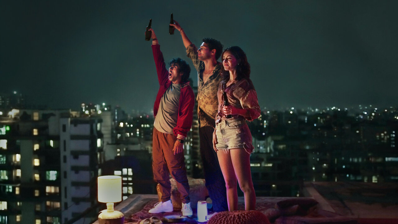 This is a movie poster of kho gaye hum kahan. staring cast siddhant Chaturvedi and aanya pande. streming on Netflix 3 friends chillng at nights.
